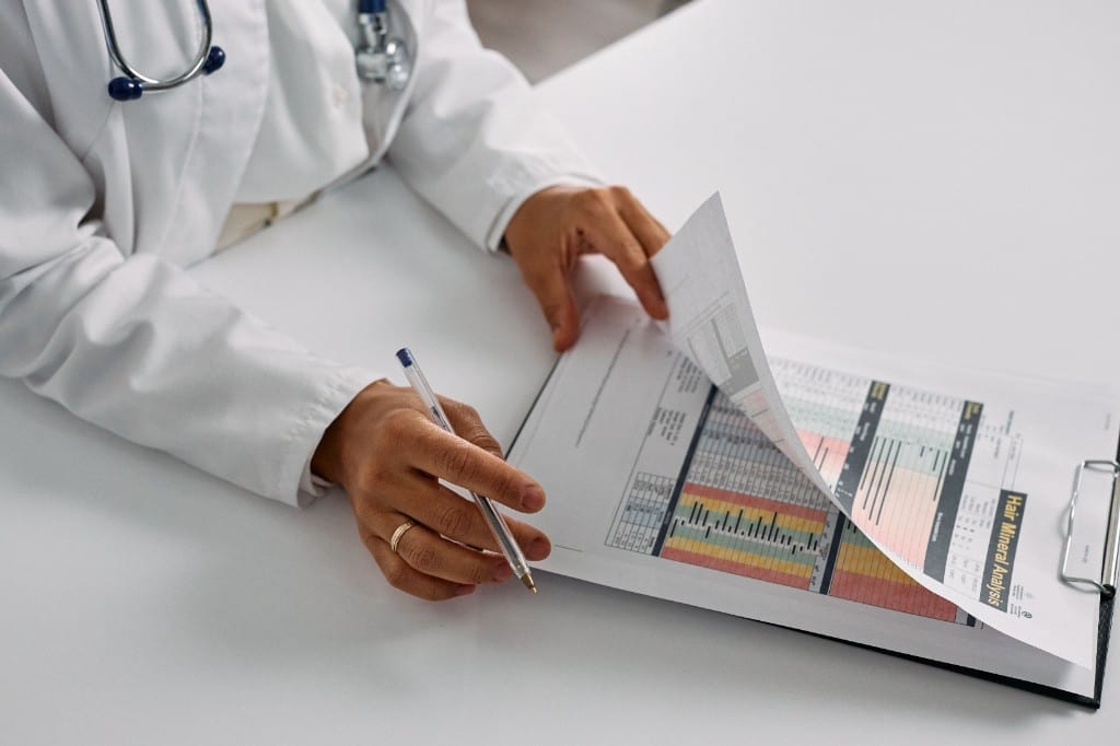 Doctor reviewing clinical analysis data